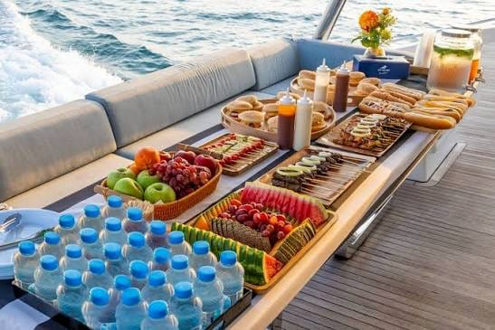 Onboard BBQ dinner setup at sunset