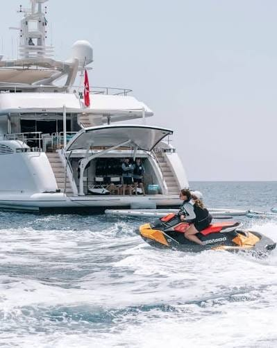 Jet ski beside a yacht